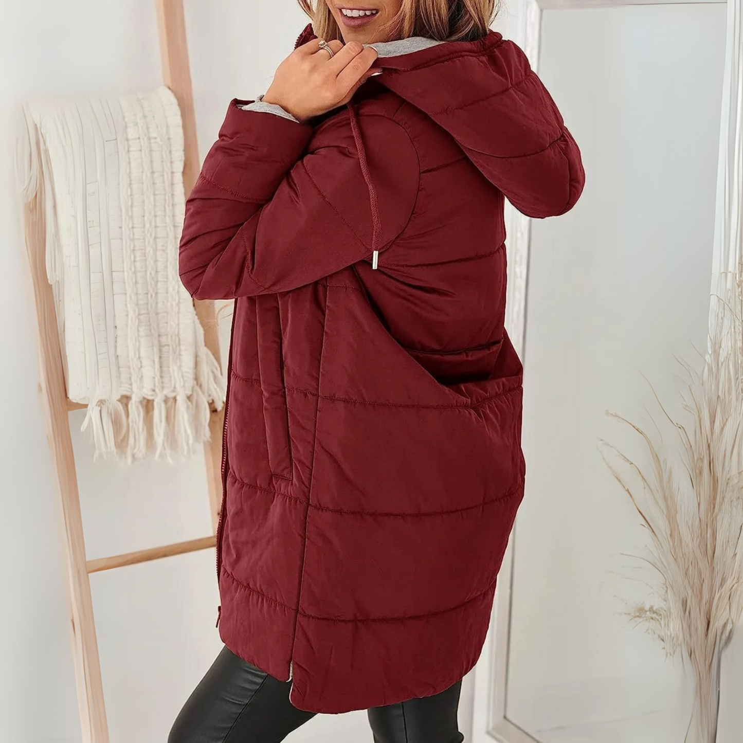 Stylish women's hooded puffer jacket with cozy warmth for winter, ideal casual outerwear.