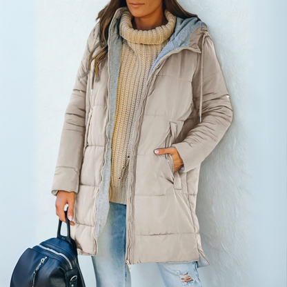 Cozy women's zippered hooded puffer jacket, providing ultimate winter warmth and comfort for cold days.