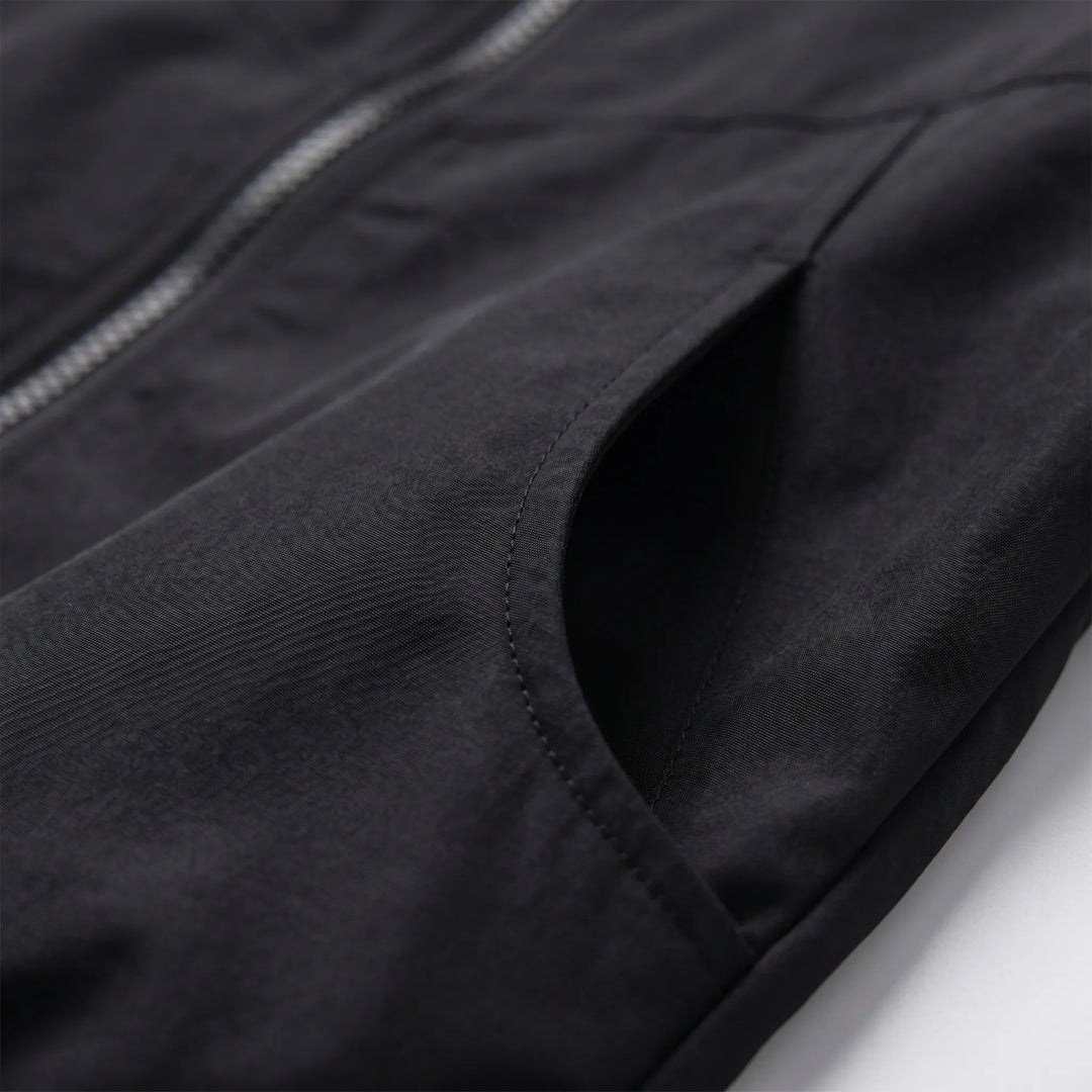 Lightweight hooded windbreaker for women. Essential casual jacket for all seasons, perfect for active or everyday wear.