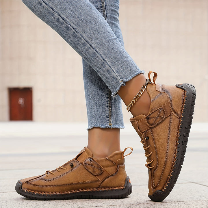 Versatile women's casual sneakers with lace-up design, comfortable and stitched, perfect for everyday wear.