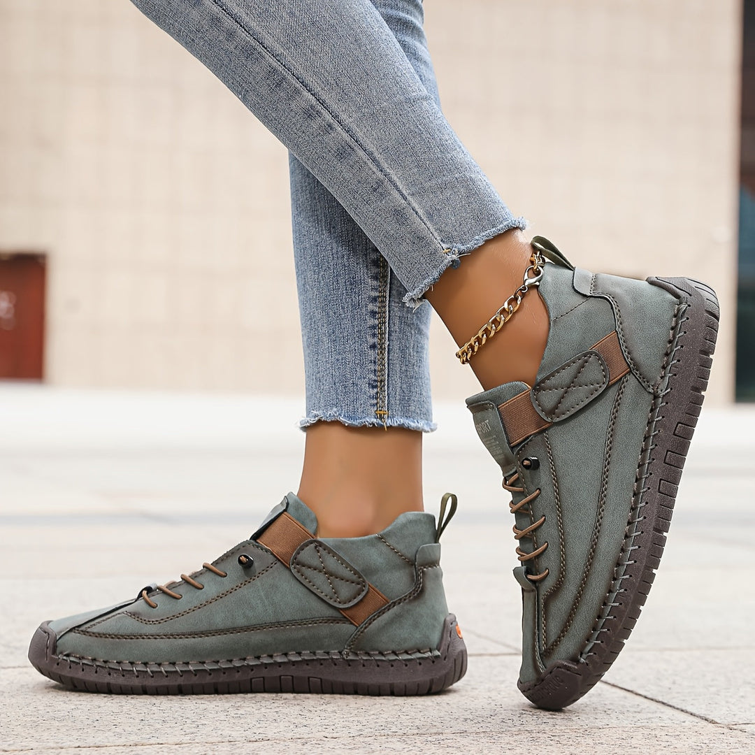 Women's casual low-top lace-up sneakers with subtle stitching, comfortable everyday footwear.