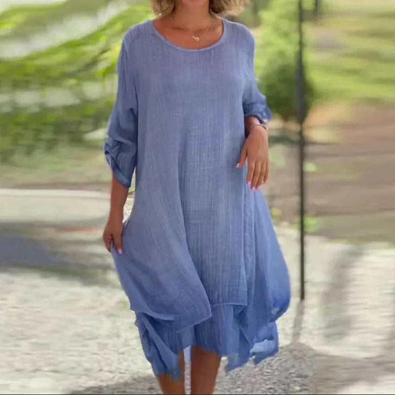 Flowy women's layered midi dress with a relaxed fit. Comfortable 3/4 sleeve casual summer style.