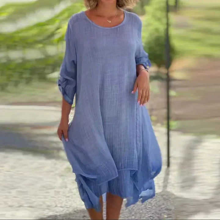 Flowy women's layered midi dress with a relaxed fit. Comfortable 3/4 sleeve casual summer style.