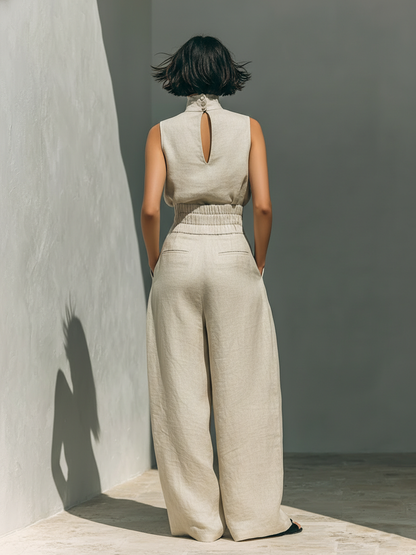 Sleeveless linen blend top and wide leg pants create a chic women's two-piece set, great for casual elegance.