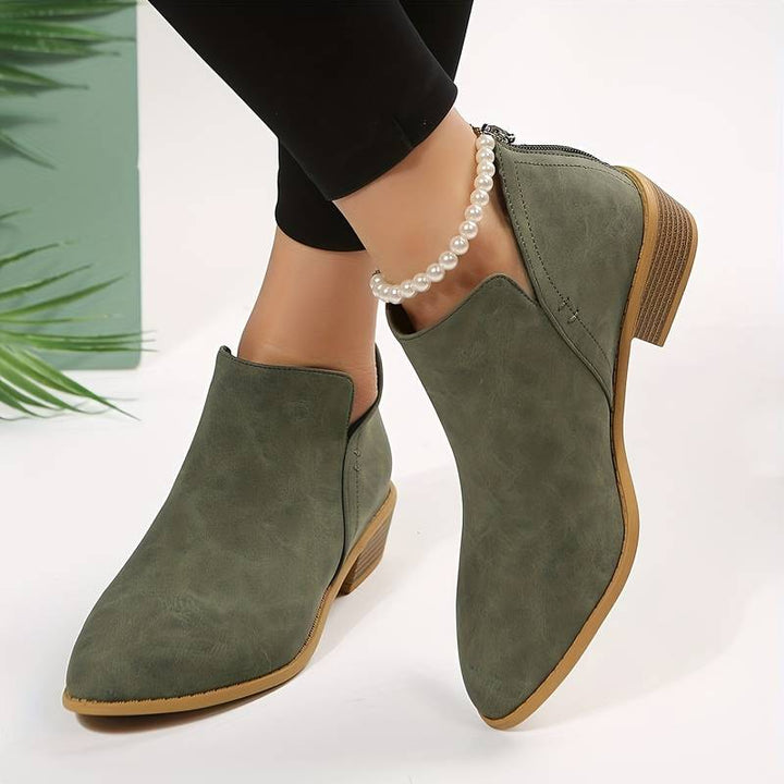 Women's casual low heel slip-on ankle boots. Comfortable everyday footwear with a chic block heel, perfect for fall.