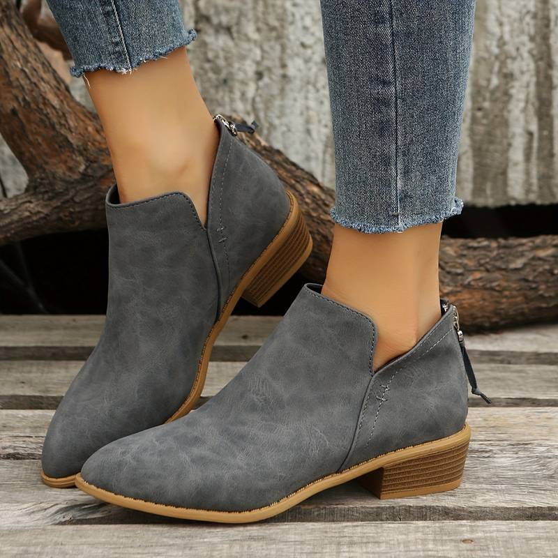 Beige women's slip-on casual boots. Versatile low block heel ankle boots for everyday style & comfort.