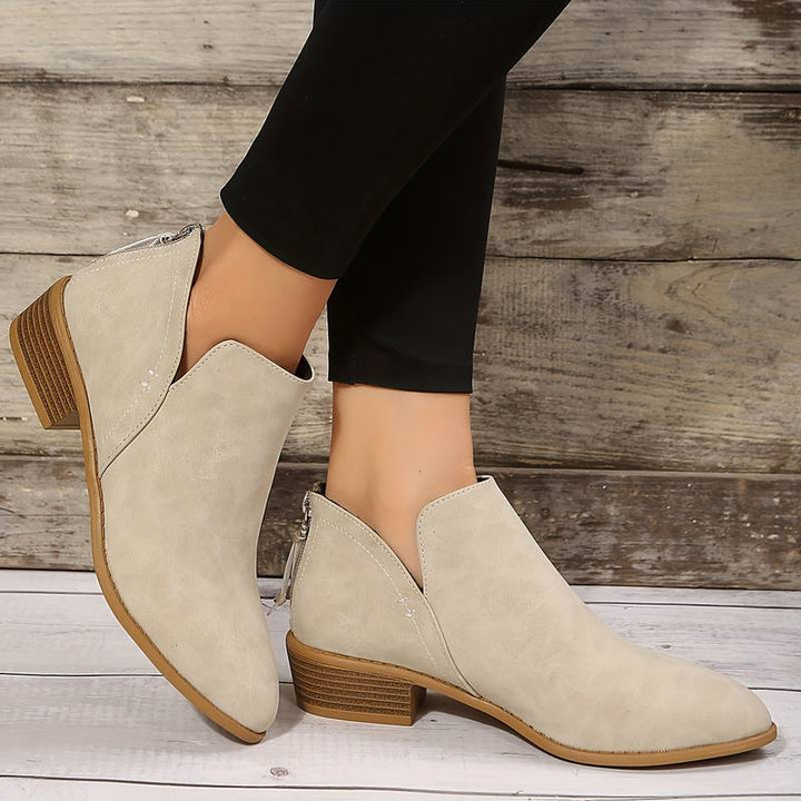 Black women's low heel slip-on boots. Chic & comfortable ankle boots, perfect for easy everyday wear.