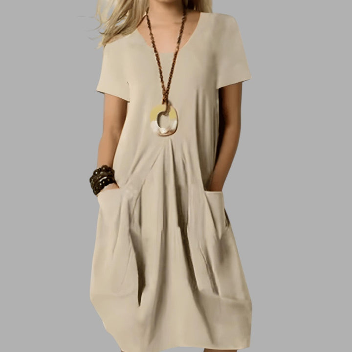 Versatile women's midi dress, ideal for casual summer fashion. Enjoy comfortable and flattering style all day long.