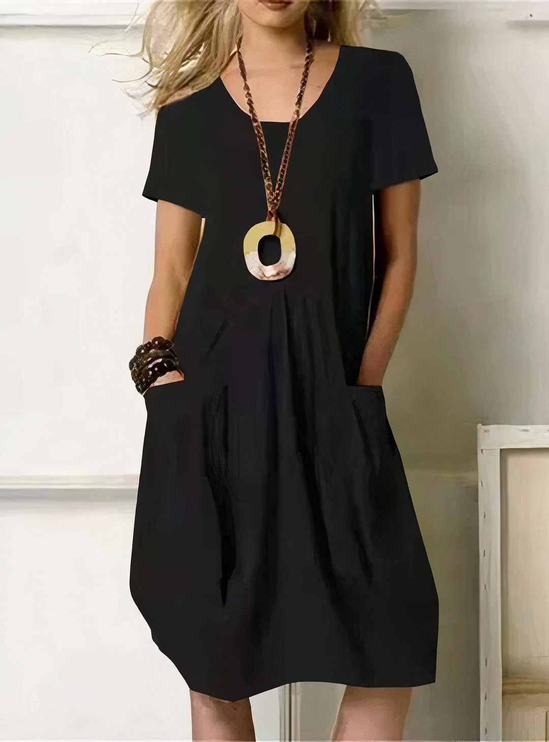 Comfortable everyday women's dress with a relaxed fit, easy care fabric, and chic versatile style.