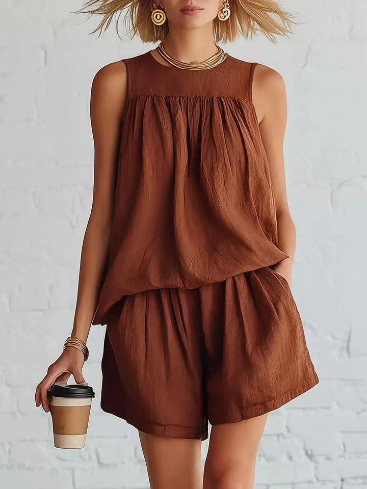 Effortless women's relaxed shorts set with sleeveless top & high-waisted shorts, a stylish casual summer two-piece outfit.