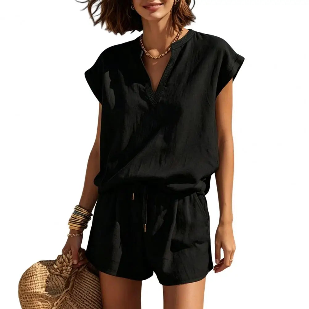 Two-piece women's summer co-ord set: short-sleeve V-neck top & drawstring shorts. Ideal for resort wear.