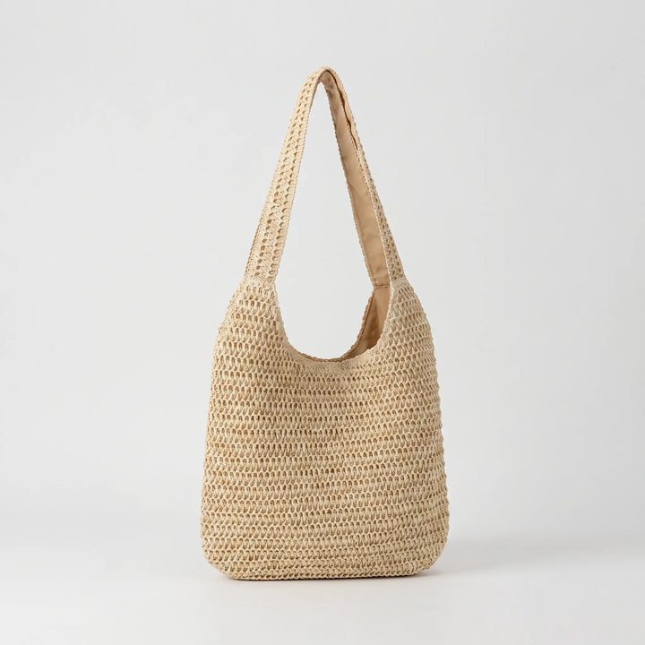 Stylish women's knit shoulder tote bag for summer, a chic accessory for travel or vacation.