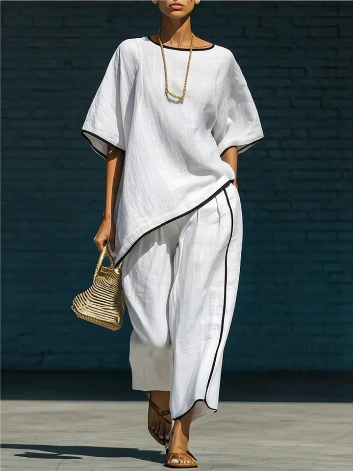 Women's summer travel outfit: chic relaxed top & wide-leg cropped pants 2-piece set.
