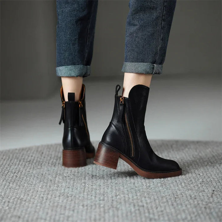 Stylish women's boots with block heel, tassel detail, and side zip closure for winter.