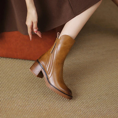 Elegant women's fall/winter ankle boots featuring a sturdy block heel & side zip.