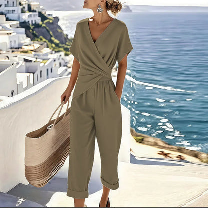 Effortlessly chic women's khaki wrap cropped jumpsuit. Versatile wide-leg design, ideal for stylish warm weather.