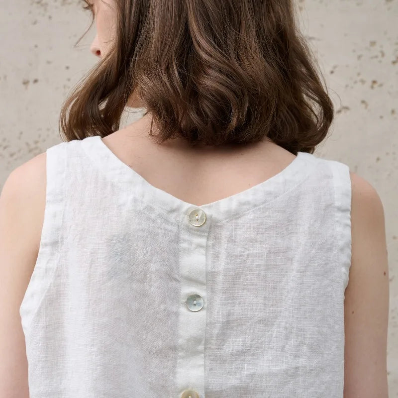 Chic women's crop top with an asymmetric hem, sleeveless design, and comfortable crew neck. Summer essential.
