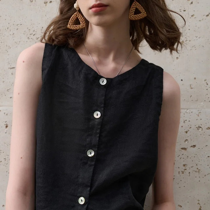 Women's relaxed fit asymmetric crop top, sleeveless, with a crew neck. A modern and versatile summer piece.