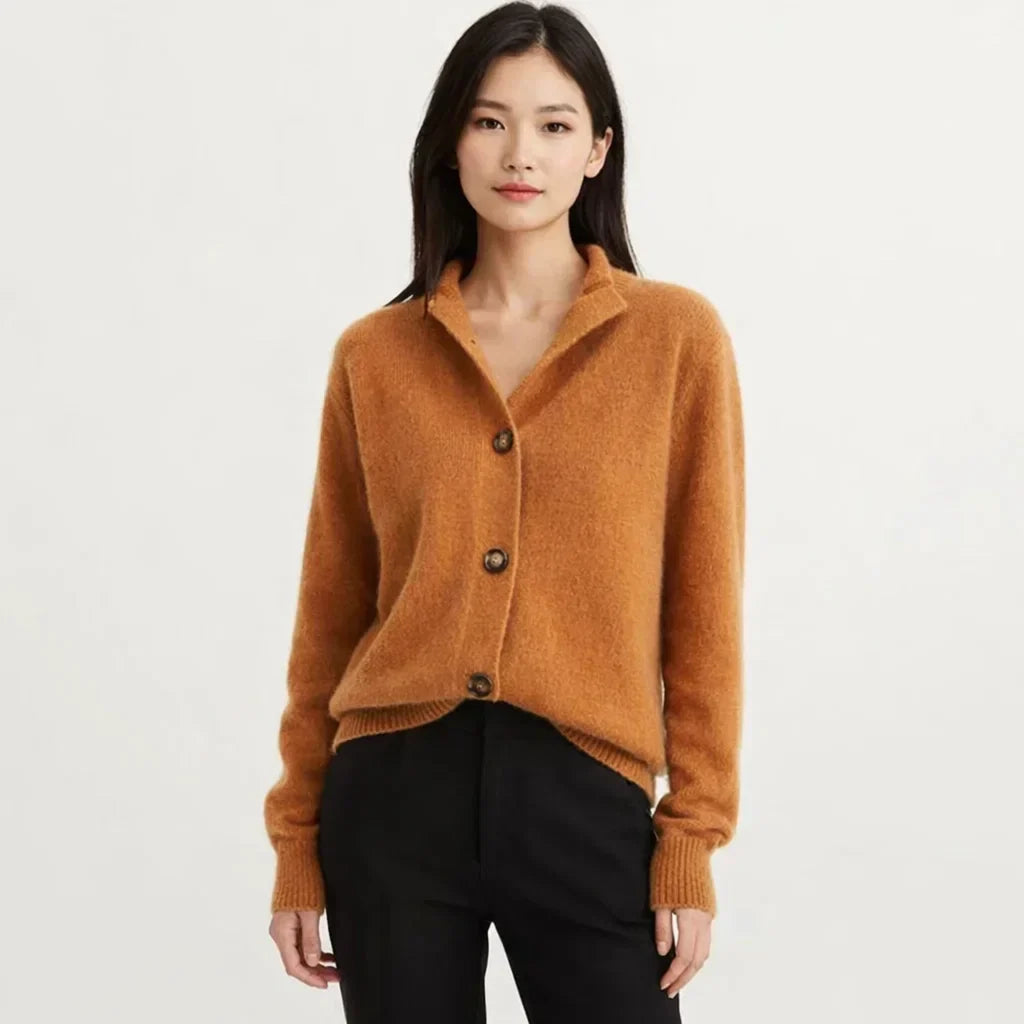 Women's chic asymmetrical knit cardigan with unique button closure, perfect for fall layering.