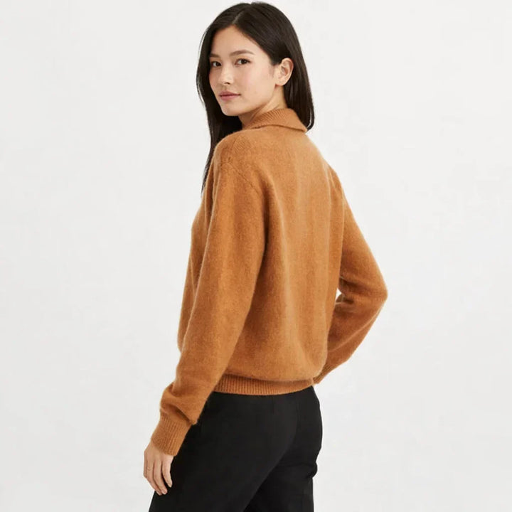 Cozy knit women's cardigan featuring an asymmetrical design & stylish buttons, ideal for winter warmth.