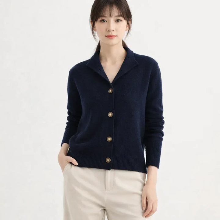 Soft knit women's cardigan, featuring an asymmetrical front & elegant button accents. Perfect for cozy layering.