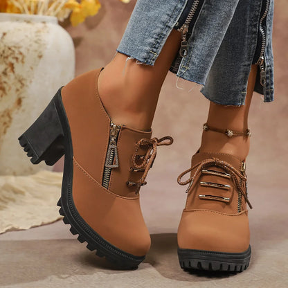 Close-up of brown women's block heel boots, highlighting orthopedic comfort & stylish design.