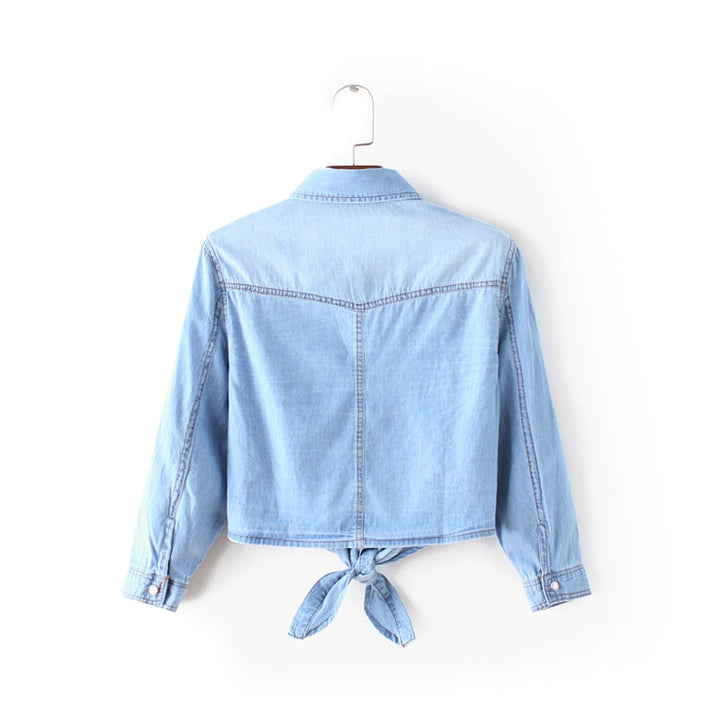 Relaxed fit women's blue tie-front button-up shirt, long sleeve, perfect versatile top for day to night.