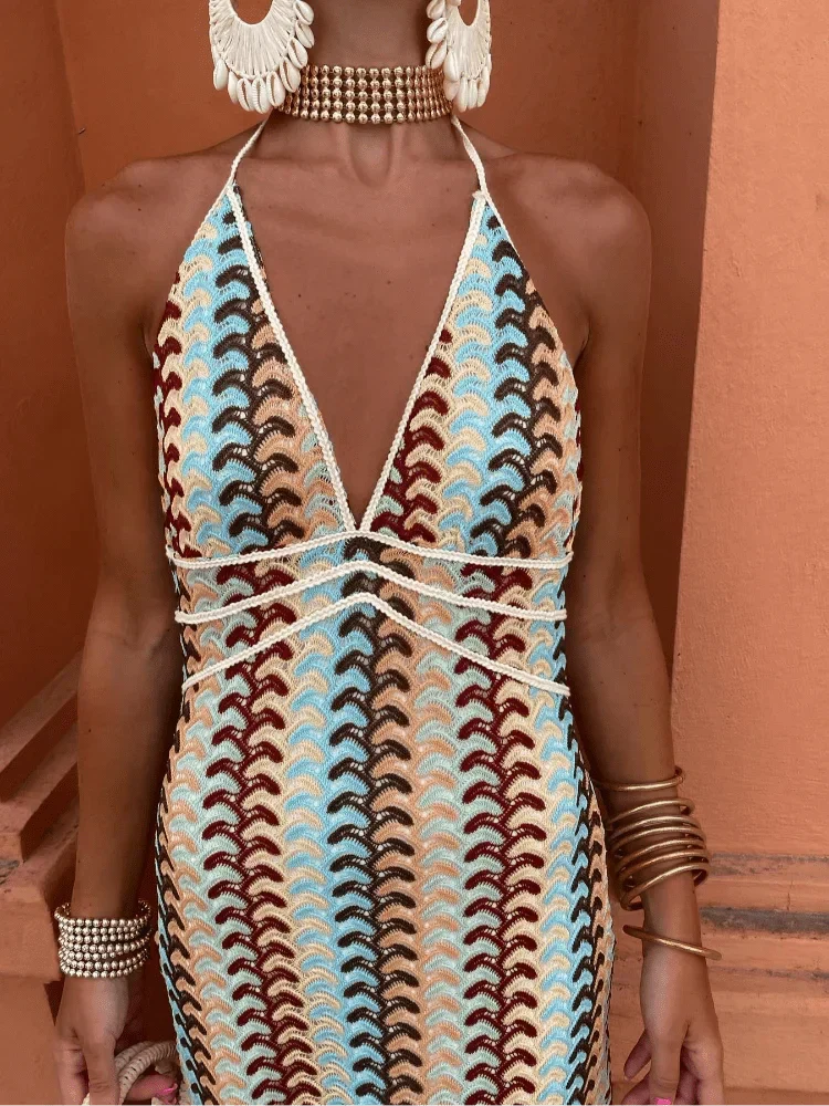 Women's printed maxi dress with a flattering open-back halter design. Chic boho style for weddings & holidays.