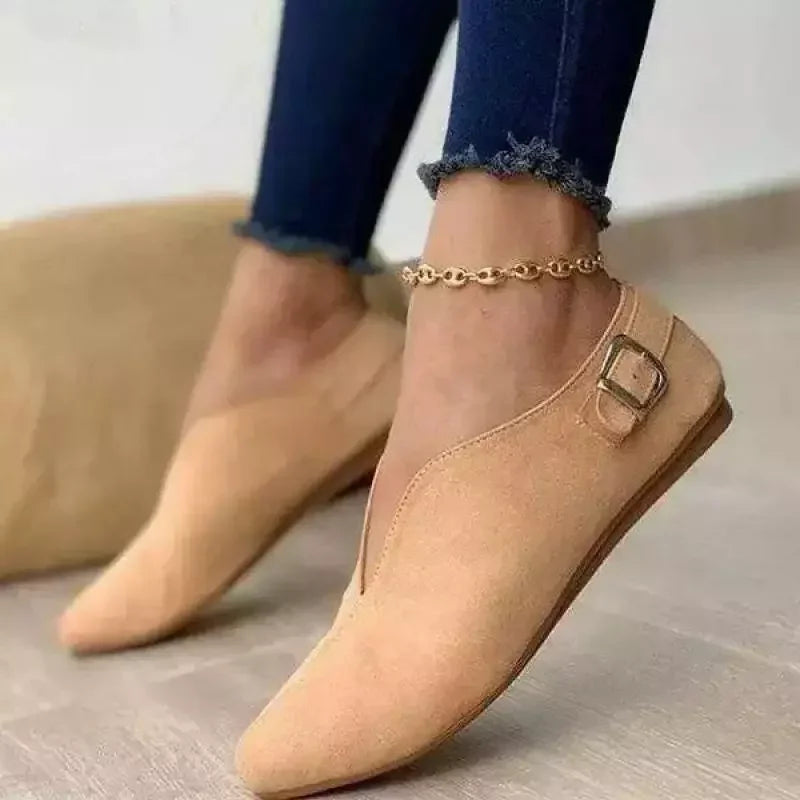 Elegant women's slip-on loafers with a chic buckle design. Comfortable and stylish footwear for everyday fashion.