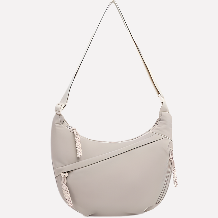 Front view of a women's fashion crescent shoulder bag, showcasing its elegant curve and unique braided handle.