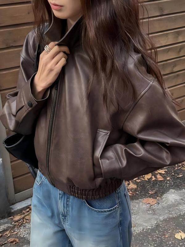 Modern women's cropped jacket, a chic statement piece. Structured collar & contemporary fit for stylish fashion.