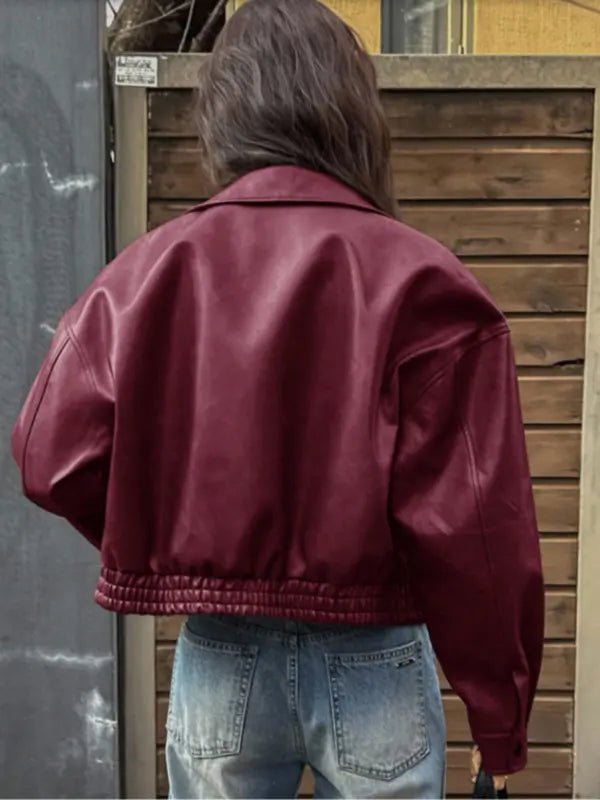 Women's fashion-forward cropped jacket with a structured collar. Its modern fit offers a chic and stylish look.