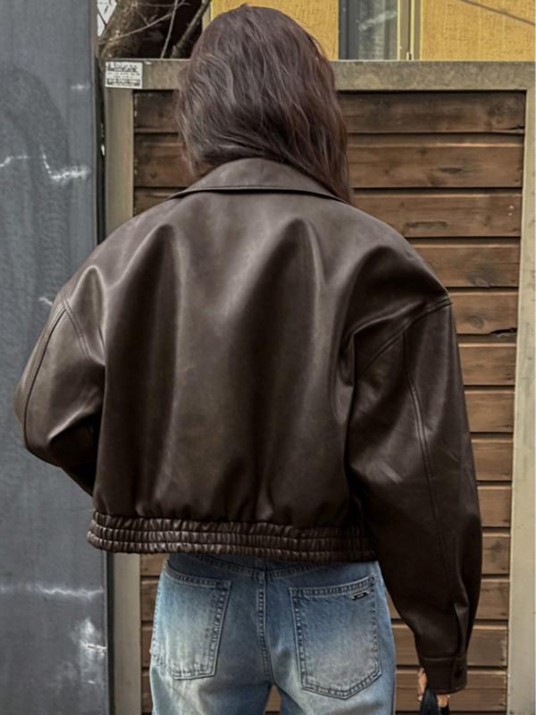 Contemporary women's chic cropped jacket. Features a structured collar & modern fit, ideal for stylish outerwear.