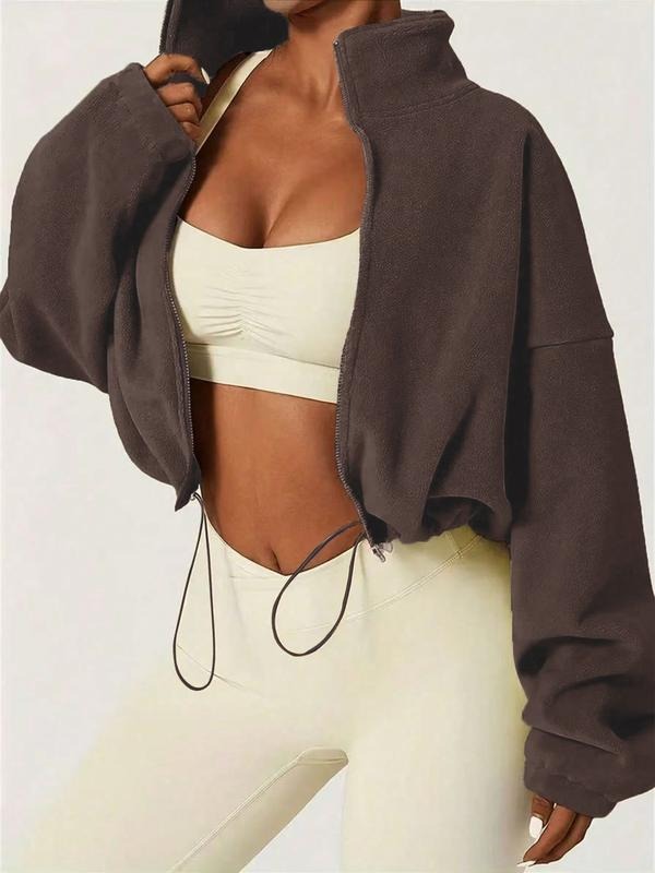 Stylish women's cropped zip jacket featuring an adjustable hem for a personalized, relaxed fit. Modern everyday wear.