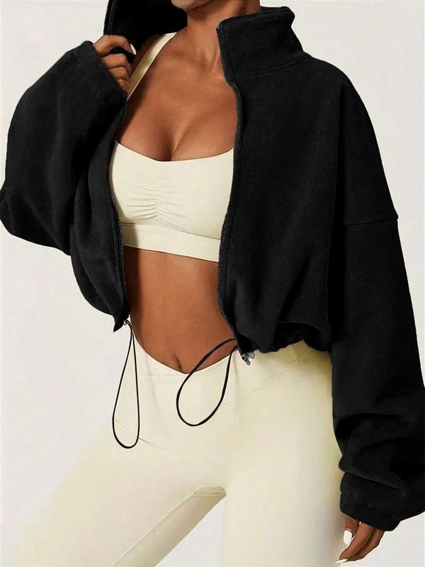 Modern women's cropped zip jacket with a high collar, ideal for casual fashion. Adjustable for a stylish, relaxed look.