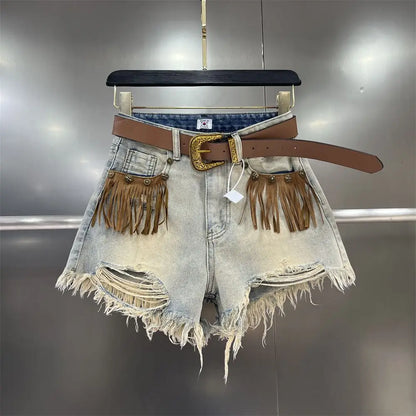 Women's chic denim shorts with stylish fringe hem, a trendy summer fashion bottom.