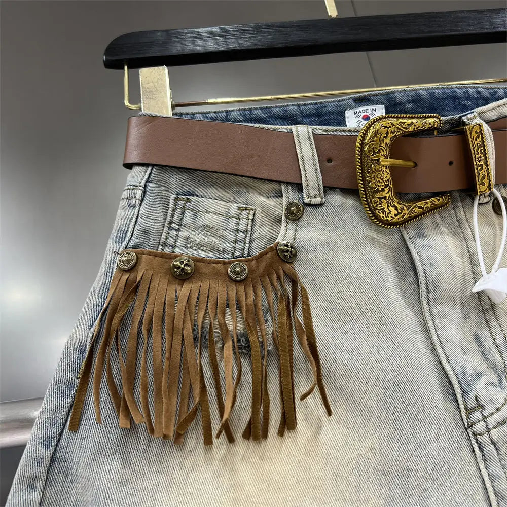 Chic women's denim shorts with a distinctive fringe hem, a must-have for warm weather style.