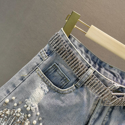 Chic women's denim tassel shorts, a fashionable and versatile bottom for summer style.