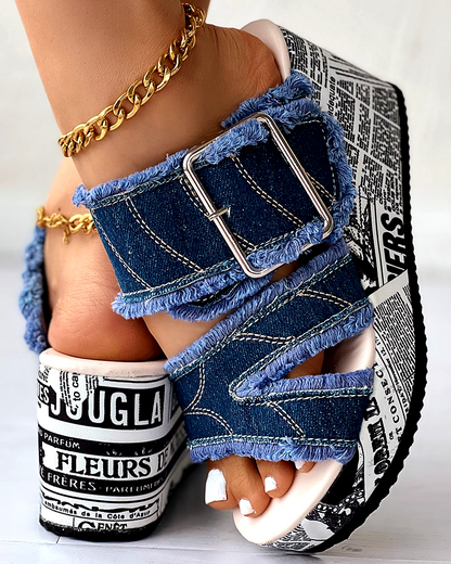Fashionable women's denim wedge sandals providing comfortable elevated style for any summer occasion.
