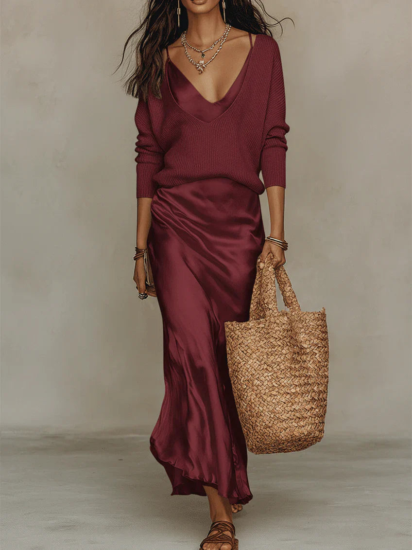 Flowing draped midi dress and soft, coordinated sweater for women. Modern, elegant two-piece fashion.