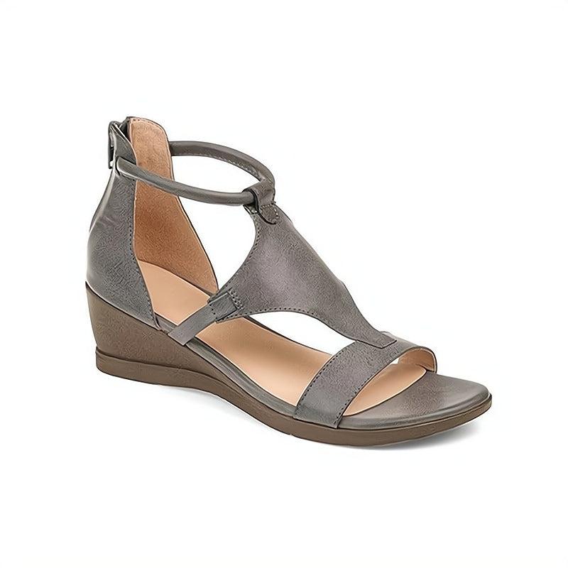 Slip-on women's comfort sandals, perfect for warm weather. Chic everyday flat design for versatile casual wear.
