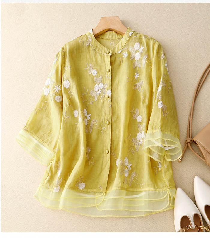 Lightweight women's long-sleeve floral blouse with elegant button & patchwork details.