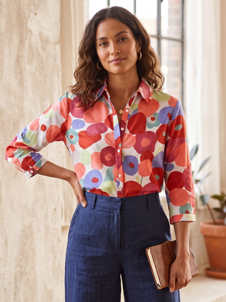 Elegant women's floral button-down blouse with functional roll-tab sleeves, ideal for chic casual wear.