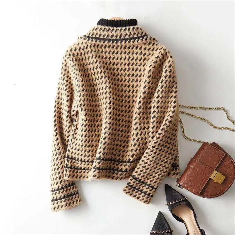 Classic houndstooth pattern on a tailored women's knit jacket, chic & elegant.
