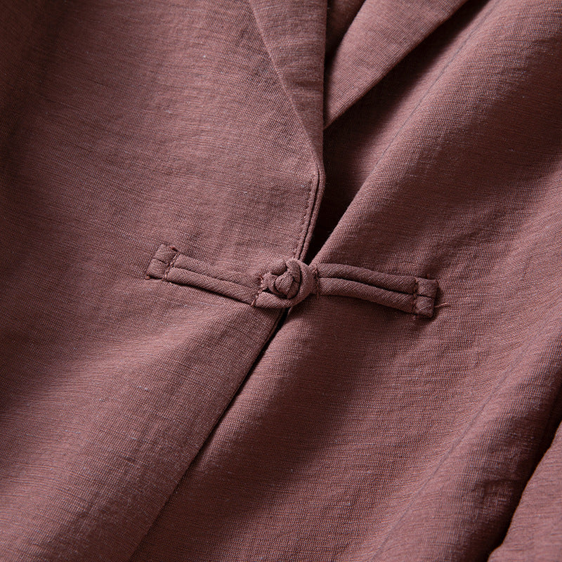 Modern women's knot-front blazer, a stylish jacket and elegant layering piece for a chic contemporary look.