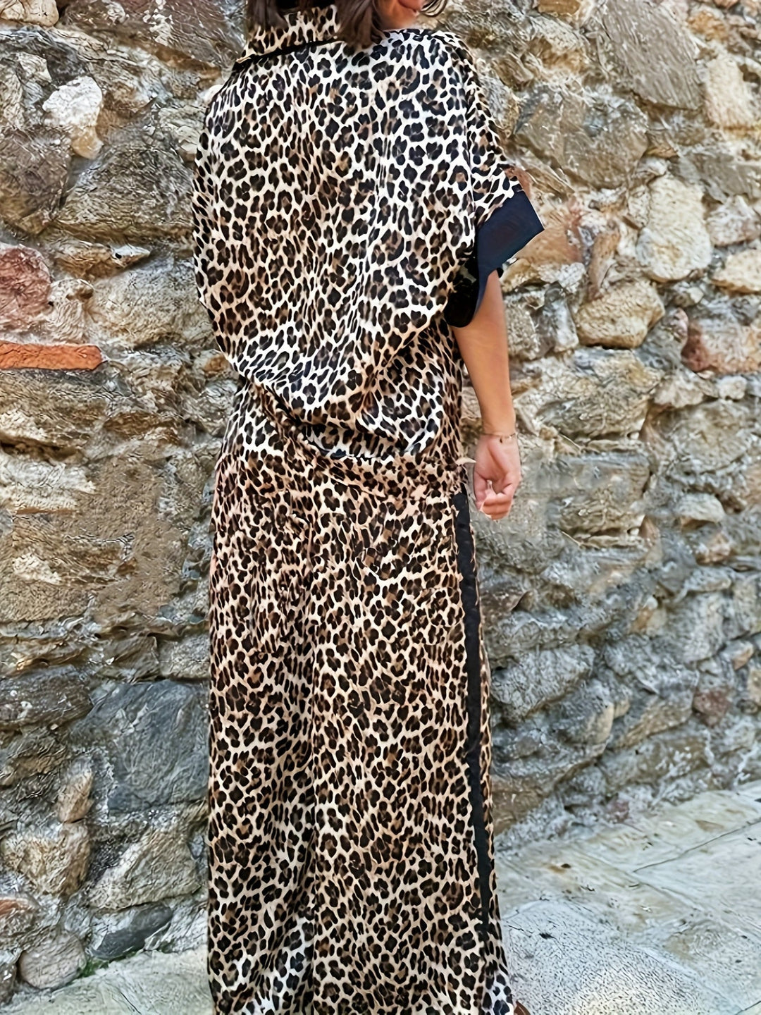 Modern women's leopard print jumpsuit with wide leg and V-neck. Flattering, comfortable for day to night wear.