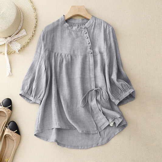 Women's chic light gray wrap blouse with elegant puffed sleeves, perfect for spring/summer fashion.
