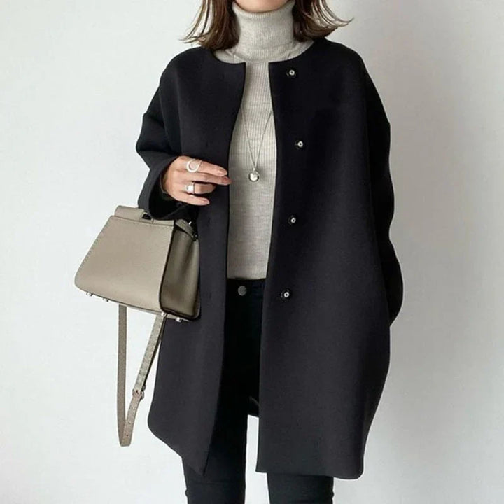 Women's chic minimalist oversized button-down coat, perfect for elegant fall & winter layering. Classic design.