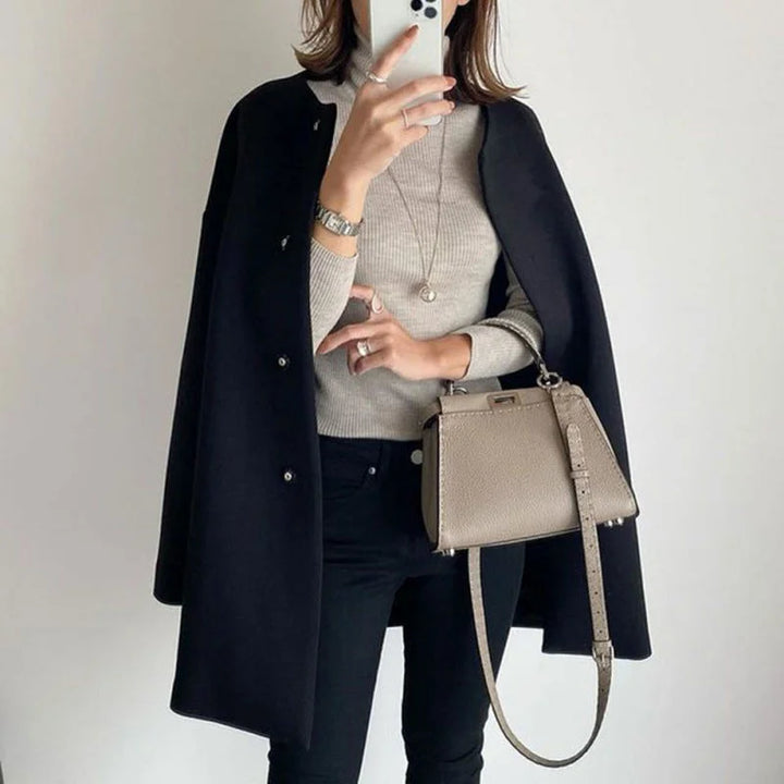 Classic women's oversized button coat, offering minimalist elegance for fall & winter. Chic and warm outerwear.