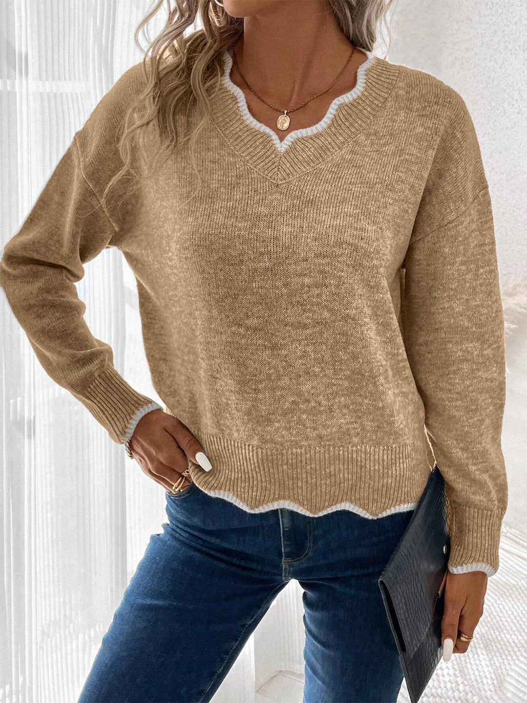 Model showcasing the relaxed silhouette of a women's notch V-neck sweatshirt, great for comfort.